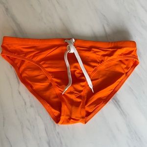 Charlie by MZ Swim Brief 
Size Small
Orange speedo
Brand: Charlie by MZ